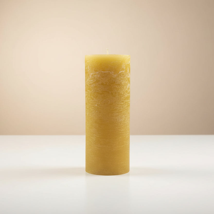 mustard candle on a white surface