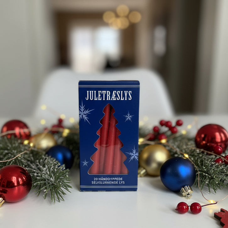 Blue pack of 20 red tree candles on a table with christmas decoration
