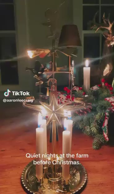 Angel chime turning with candles in a festive room