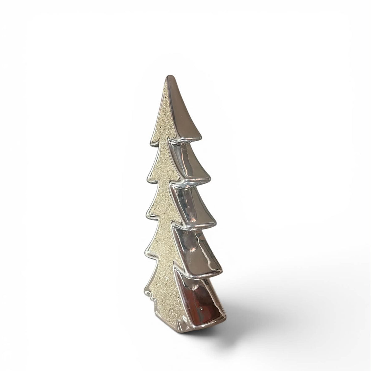 Silver Christmas tree-shaped ornament with a textured, glittery silver finish, standing upright on a white background.
