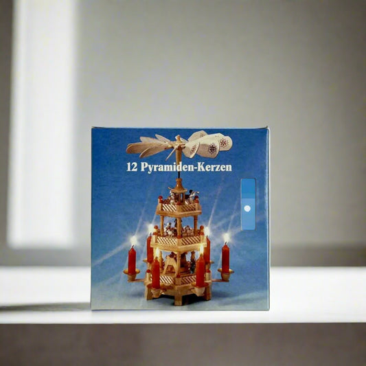 twelve white pyramid candles in a box