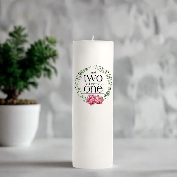 White wedding candle with floral wreath design.