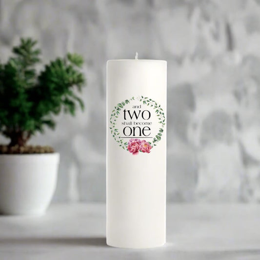 White wedding candle with floral wreath design.