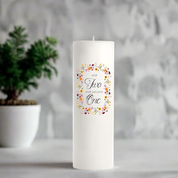 White wedding candle with colorful flower design and text on a gray background