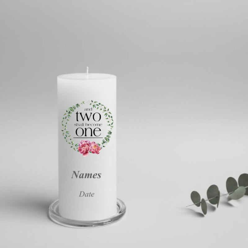White wedding candle with decorative text and floral design on a gray background