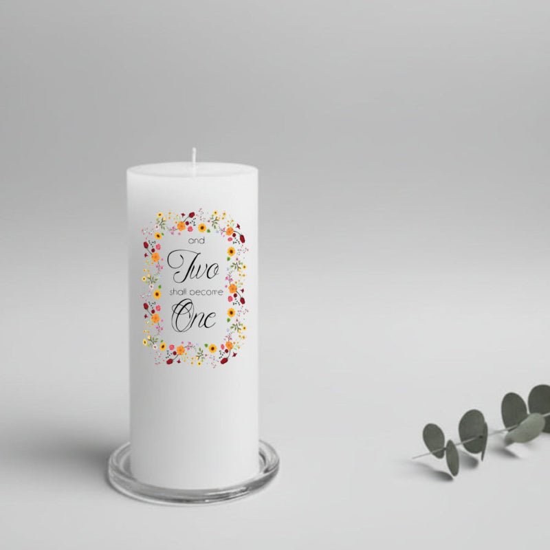 White wedding candle with colorful flower design and text on a gray background