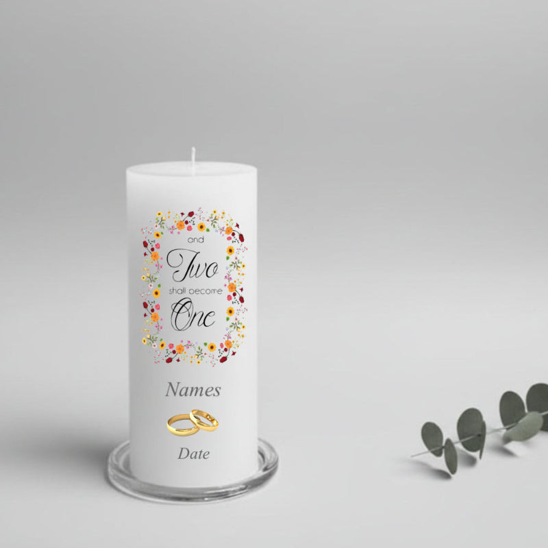 Personalized wedding candle with floral design and text on a gray background