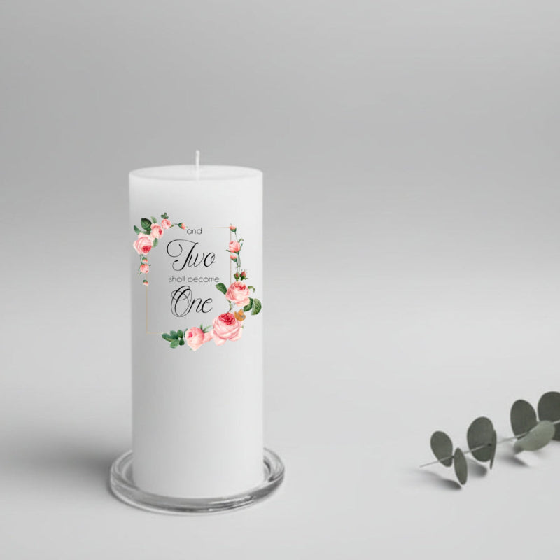 White wedding candle with floral design and text on a gray background