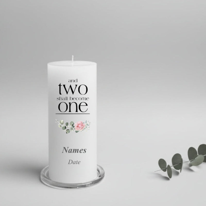White wedding candle with text and floral design on a gray background