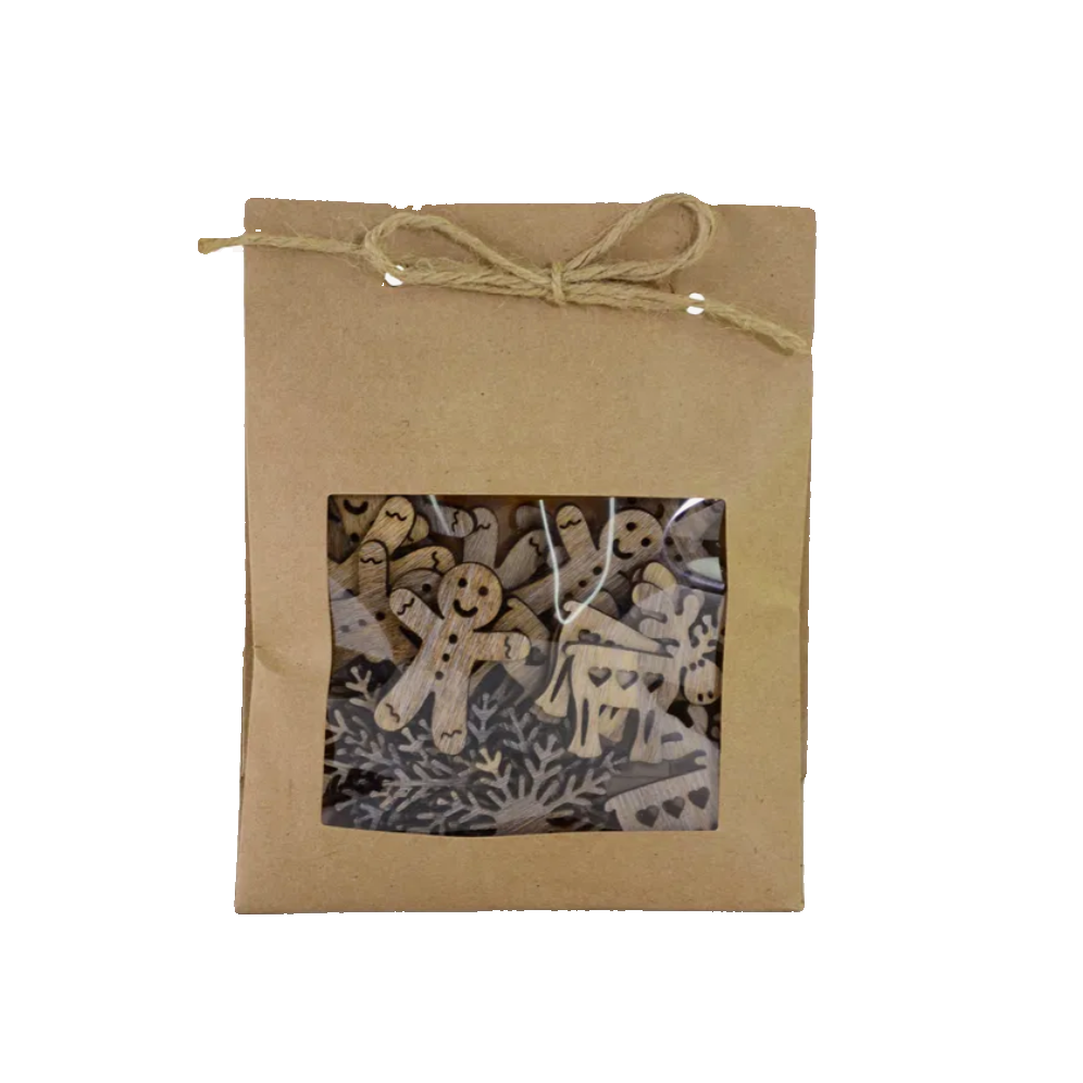 Kraft paper gift box with window displaying wooden scatter decoration, gingerbread men, deer and snowflakes 